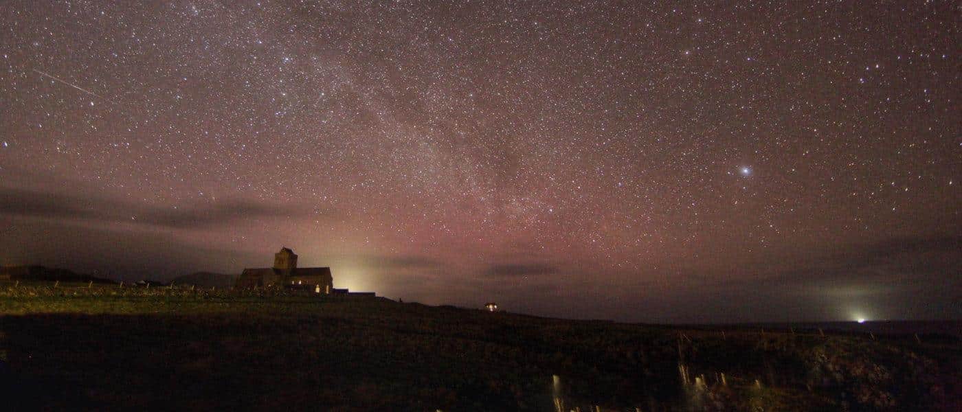 Iona Abbey under a starfield at dusk